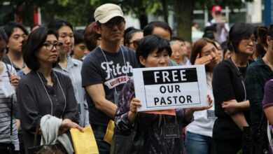 woman with sign 1.jpg.size .custom.crop .1086x724
