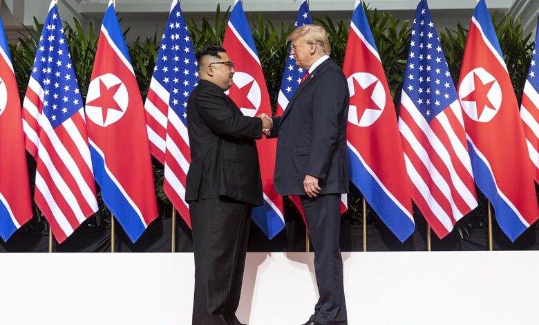 1200px Kim and Trump shaking hands at the red carpet during the DPRK–USA Singapore Summit